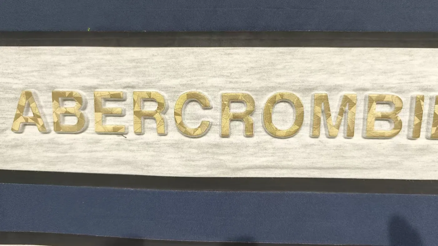 High-Frequency Embossed Label — material sample photographed on white
