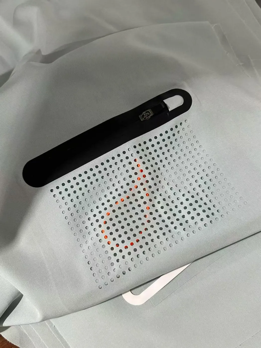 Heat-Sealed Pocket Processing — material sample photographed on white