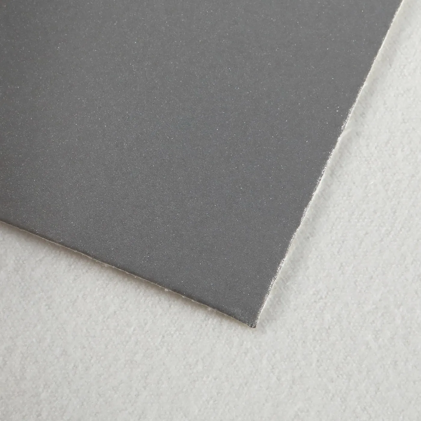 PU reflective leather corner, fine grey coated grain over a white knit backing