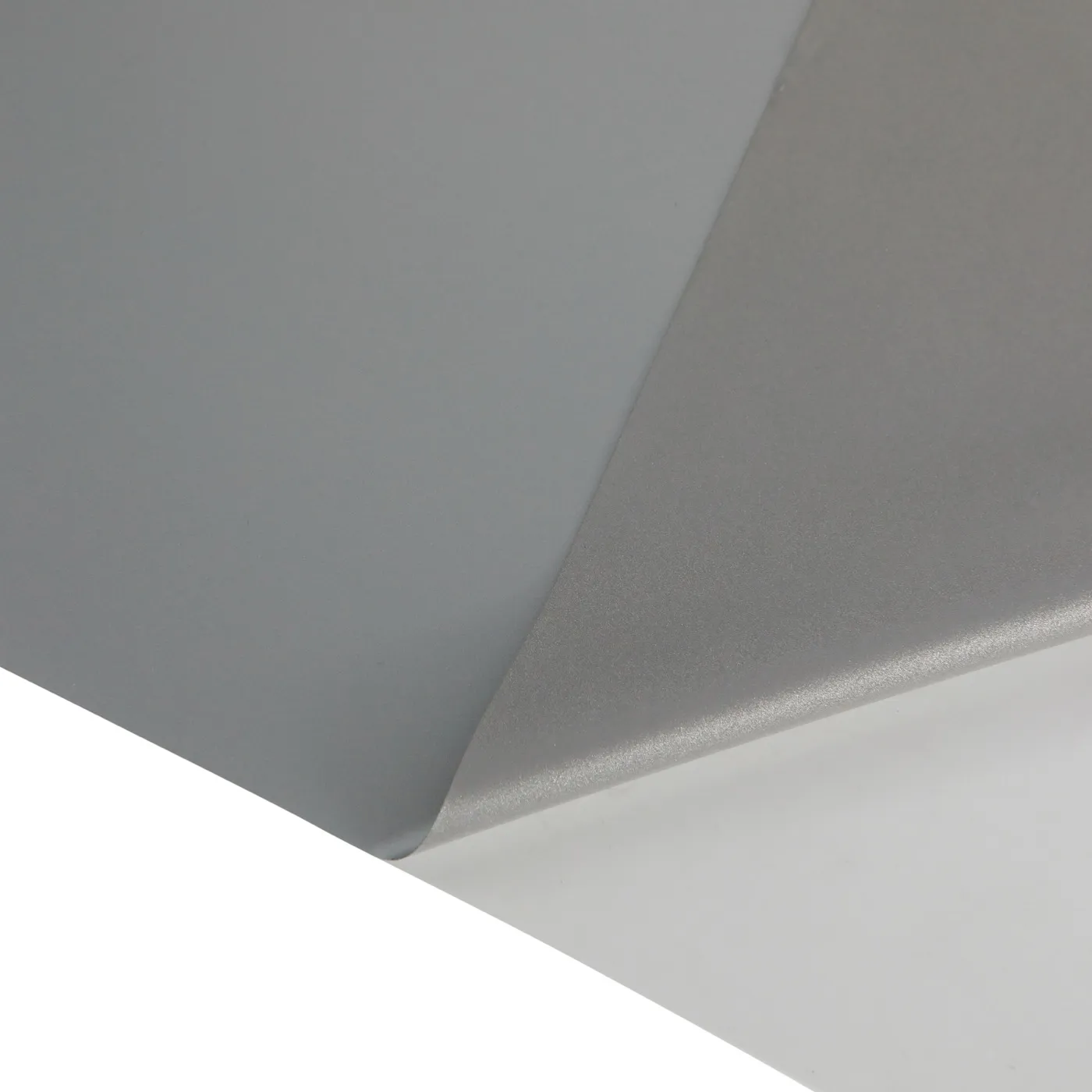 Bright silver reflective heat transfer film, folded sheet showing matte grey face and glass-bead coated reverse